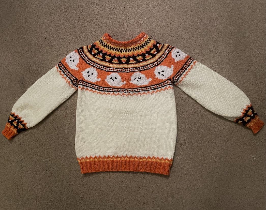 r/knitting - Just finished: “Let’s Boo-gie” for my friends daughter🧡 My first attempt at fair isle and knitting in the round