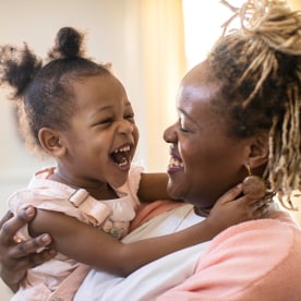 Mother and daughter laughing