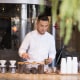 A barista prepares drinks at a coffee shop in Beijing on March 6th, 2024.