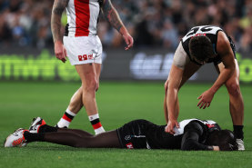 Aliir Aliir after his was dumped in a tackle by Jack Higgins.