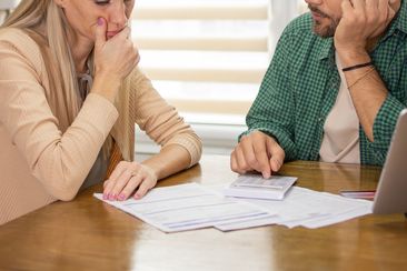 Young couple is planning a household budget