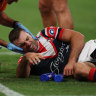 James Tedesco is treated for concussion after Bailey Simonsson’s high shot.