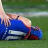 Concerned teammate Clayton Oliver checks on Melbourne’s Angus Brayshaw after he was knocked out after clashing with Collingwood’s Brayden Maynard during the 2023 finals series.