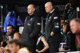 ADELAIDE, AUSTRALIA - MAY 02: Ken Hinkley, Senior Coach of the Power coaching from the bench during the 2024 AFL Round 08 match between the Adelaide Crows and the Port Adelaide Power at Adelaide Oval on May 02, 2024 in Adelaide, Australia. (Photo by Sarah Reed/AFL Photos via Getty Images)