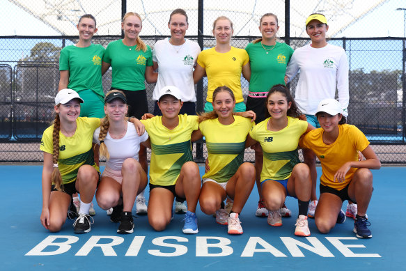 Team Australia (back row from left) Storm Hunter, Taylah Preston, Sam Stosur, Daria Saville, Ellen Perez and Arina Rodionova pose with junior Australia tennis players Jennifer Ott, Vesna Marinkov, Emilie Chen, Jizelle Sinai, Renee Alame and Koharu Nishikawa during a practice session ahead of the Billie Jean King Cup qualifier at Pat Rafter Arena in April.