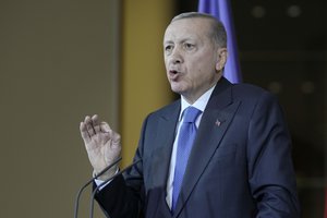 Turkey's President Recep Tayyip Erdogan talks to the media at a press conference during his visit at the chancellery with German Chancellor Olaf Scholz in Berlin, Germany, Friday, Nov. 17, 2023