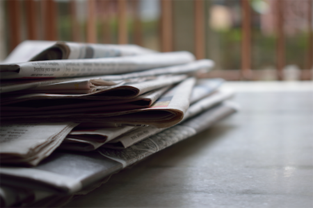 Stack of folded newspapers