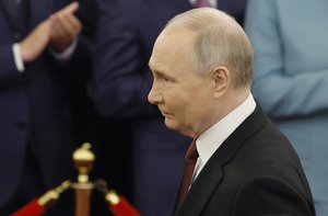 Vladimir Putin walks to take his oath as Russian president during an inauguration ceremony in the Grand Kremlin Palace in Moscow, Russia, Tuesday, May 7, 2024. (Maxim Shemetov/Pool Photo via AP)