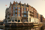 Board a classic wooden boat from the hotel’s riverside terrace for a private guided canal tour to the Van Gogh Museum.