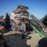 Palestinians arrive in central Gaza after leaving Rafah.