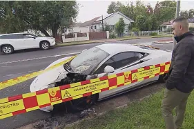 Pedestrian caught setting McLaren on fire