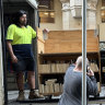 Removalists at the City Library taking away a truckload of books. 