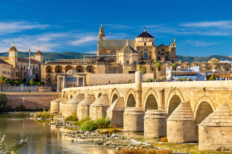 The Roman Bridge across the Guadalquivir river and the marvellous Mosque-Cathedral in Cordoba, Spain.