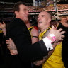 Brendon Gale (left) and Dustin Martin embrace after the 2017 grand final. 