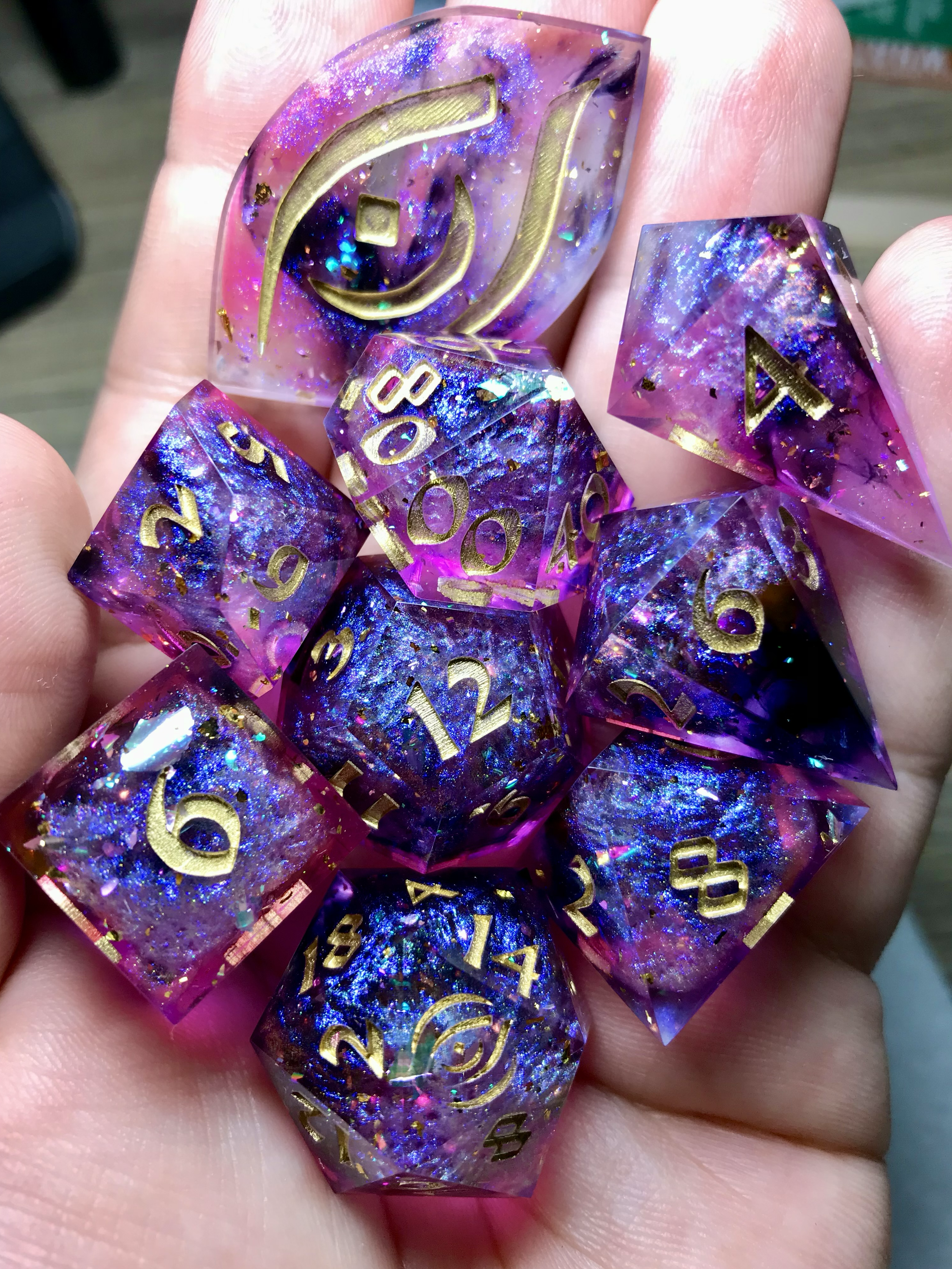 r/DnD - [OC] Celebrating the launch of my solo-dev sourcebook Sword of Souls 5E, I'm giving away this handmade glimmering 9-piece dice set! (Mod Approved)