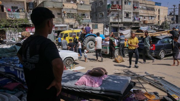 Displaced Palestinians in Rafah pack up their belongings, to leave for a safer place.