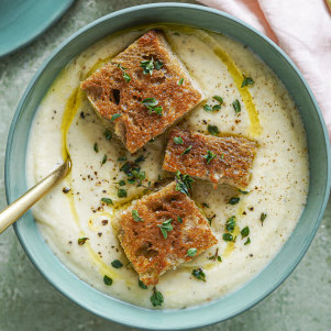 Creamy cauliflower and potato soup topped with mini cheese toastie bites.