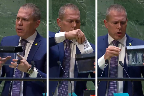 Israel’s UN ambassador Gilad Erdan theatrically inserted a miniature copy of the UN charter into a transparent paper shredder.