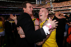 Brendon Gale (left) and Dustin Martin embrace after the 2017 grand final. 