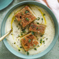 Creamy cauliflower and potato soup topped with mini cheese toastie bites.