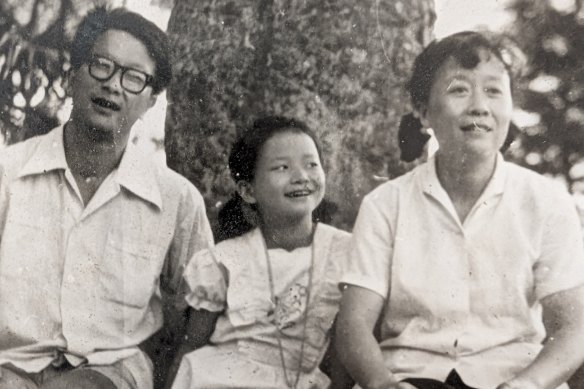 Journalist Cheng Lei (centre, aged 9) with dad Chu-yong and mum Hua in Hunan province, China, 1984, right before Chu-yong came to Australia as a visiting scholar.