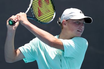 ruz Hewitt play doubles during a training session with Alex de Minaur