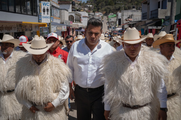 Senatorial candidate Willy Ochoa walks with other PRI candidates before beginning his rally in San Juan Chamula, Mexico.