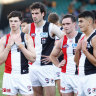 Dejected St Kilda players after their loss to Hawthorn.