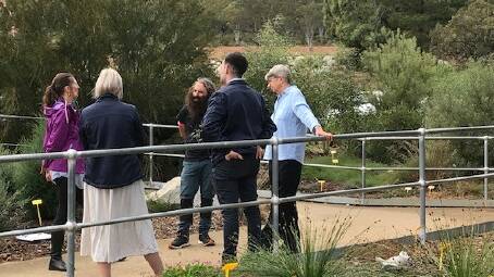 Gardening Australia host Costa Georgiadis and his producer (left) chat with Goulburn Mulwaree Council Visitors Centre staff and FROGS volunteer, Pauline Husen (right). Picture supplied.