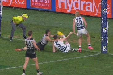 Despite the umpire blowing the whistle, many players played on and Jeremy Cameron toed through this goal, but was denied.