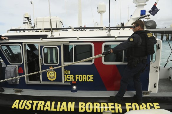 Australian Border Force (ABF) marine tactical officer Michael Kingston on a fast response boat patrolling off Thursday Island. The ABF has increased their presence in the Torres Strait as a part of Operation Overarch that was designed to protect the Torres Strait protected zone. Torres Strait Treaty normally allows people to travel freely back and forth between the Torres Strait and PNG Treaty villages but this has been suspended due to the COVID-19 threat and both countries closing their borders. Daily life Saibai island, vaccination, Australian Border Force, Operation Overarch. Climate Change. Thursday Island, Torres Strait. 2nd June, 2021. Photo: Kate Geraghty 

