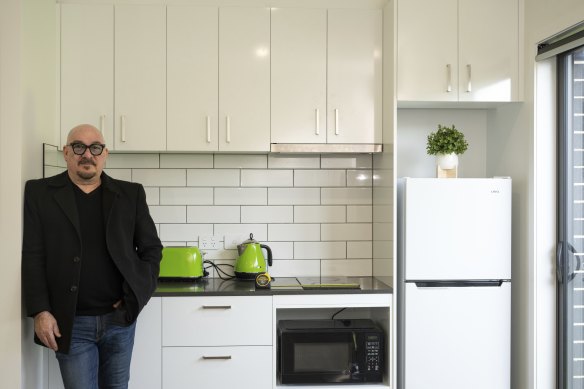 Developer Frank Days in one of the rooms of a rooming house development in Melton.