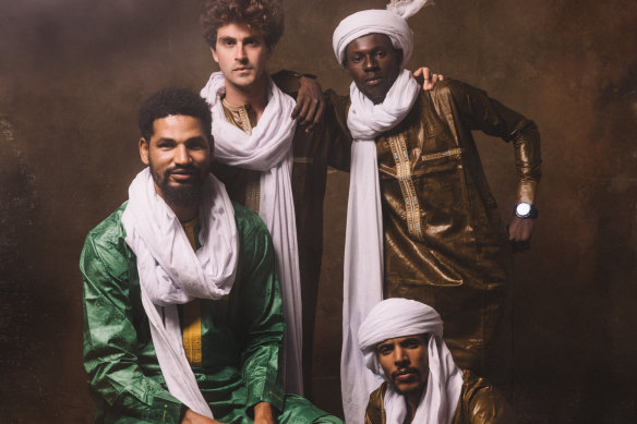 Mdou Moctar (left), with band: rhythm guitarist Ahmoudou Madassane, drummer Souleymane Ibrahim, and bassist Mikey Coltun.