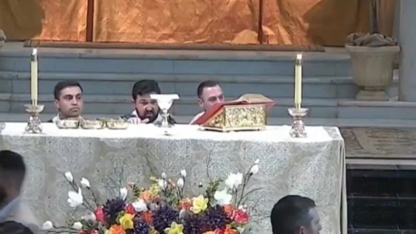 Clergy react during the incident in the Louisiana church.