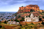 The royal cenotaphs stand out in blinding white marble against the barren landscape.