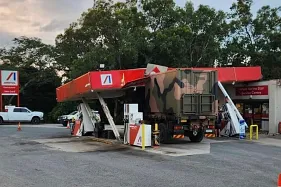 Military truck ploughs through Queensland petrol station