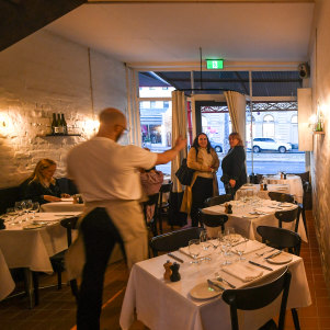 Peek inside Bistra to find white-clothed tables and whitewashed walls.