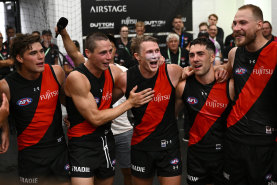 Sam Durham, Jake Kelly, Xavier Duursma, Jade Gresham and Ben McKay of the Bombers sing the song.