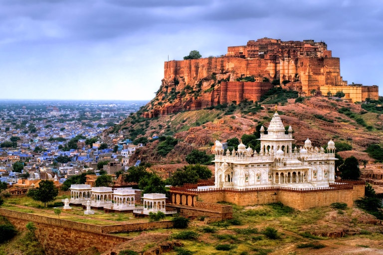 The royal cenotaphs stand out in blinding white marble against the barren landscape.