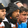 Wests Tigers coach Benji Marshall (second from left) on the bench in Tamworth.