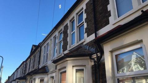 A view of houses in a street in Cardiff