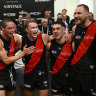 Sam Durham, Jake Kelly, Xavier Duursma, Jade Gresham and Ben McKay of the Bombers sing the song.