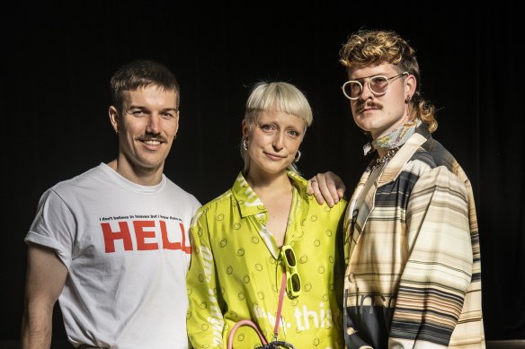 Guests at the Alix Higgins show at Australian Fashion Week, Sam Passmore, Annaliese Griffith-Jones and Russell Phillip.