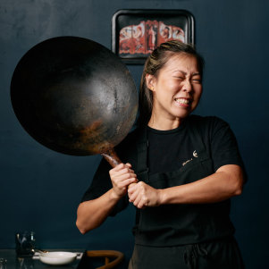 Emily Yeoh with a larger version of the $15 wok she recommends from Yuen’s in Brisbane, or a similar Asian grocery store.