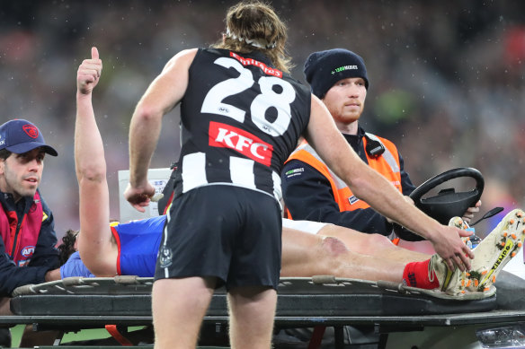 Collingwood defender Nathan Murphy consoles Angus Brayshaw as he leaves the ground after being concussed in the qualifying final. Both players are now retired due to medical advice following a series of concussions