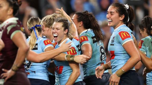 Emma Tonegato of the Blues celebrates a try.