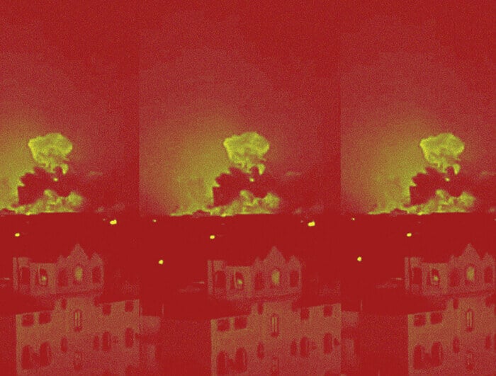 An explosion rising above a city in the distance is repeated three times from left to right.