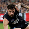 Will Hoskin-Elliott of the Magpies and Zac Williams of the Blues compete for the ball.