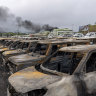 Burnt cars are lined up after unrest that erupted following protests over voting reforms in Noumea, New Caledonia.