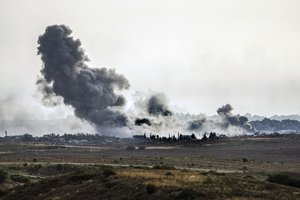 Smoke rises following an Israeli airstrike in the Gaza Strip, as seen from southern Israel, Friday, May 17, 2024.